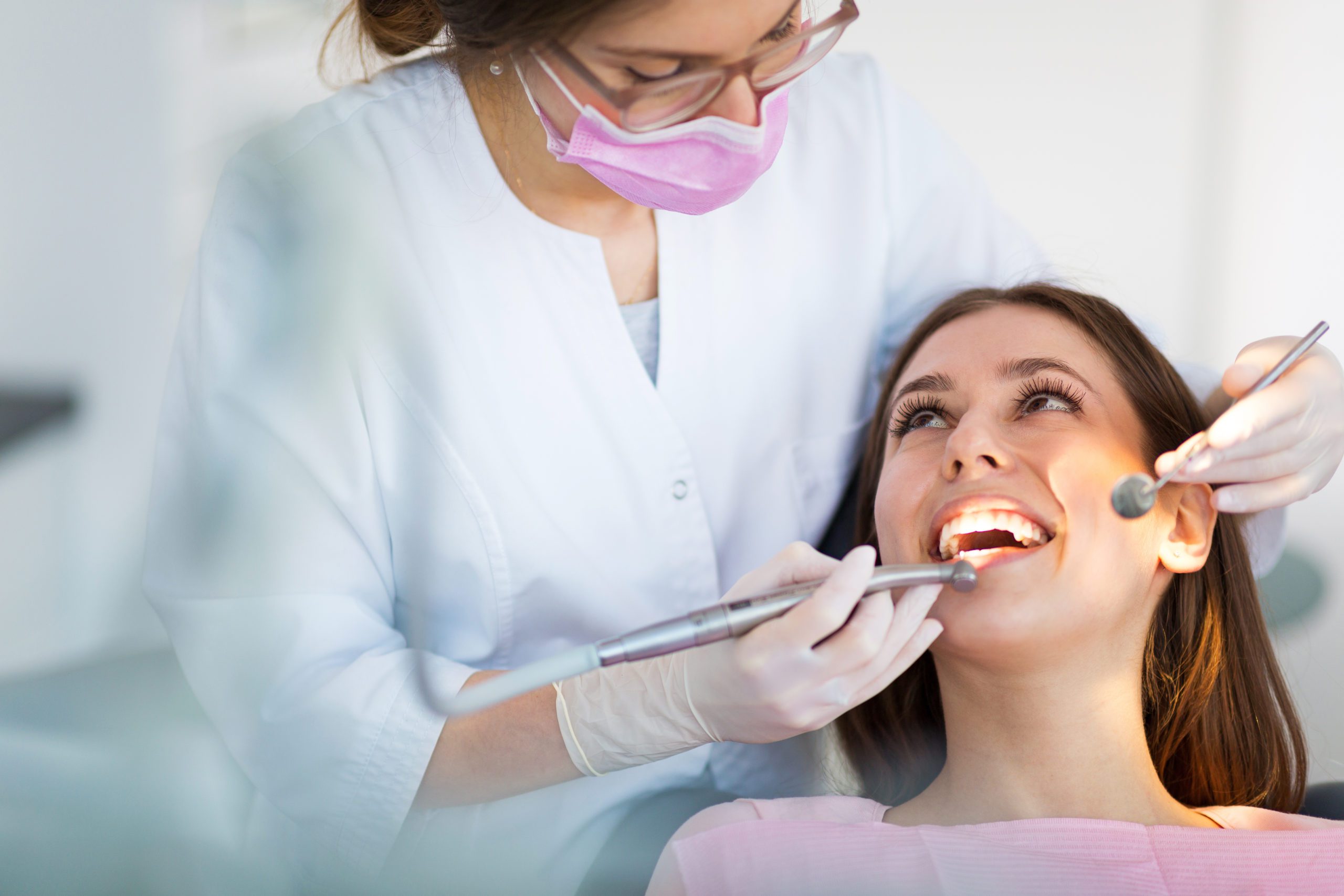 woman sits with an affordable dentist from west richland family dental located in rich land, wa